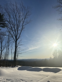 A picture of the skyline, overlooking a part of Hanover's snowy mountains.