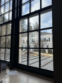 A view from inside the main cafeteria looking out onto campus