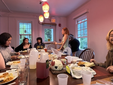 People gathered around La Casa's dinner table