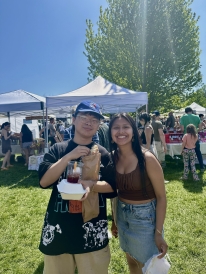 Posed picture of two friends at the Norwich Farmer's Market