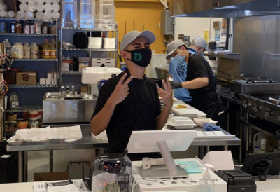 Robin working as a cashier at a taco restaurant