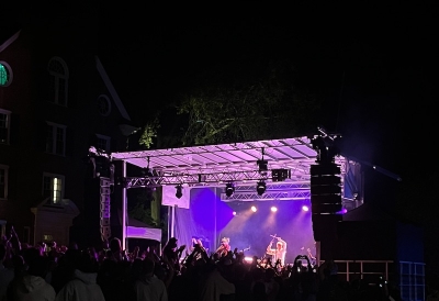 An image of a concert and an audience on Tuck Drive
