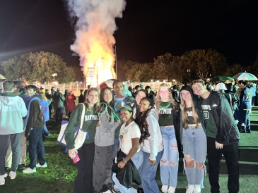 My friends and I posing in front of the bonfire.