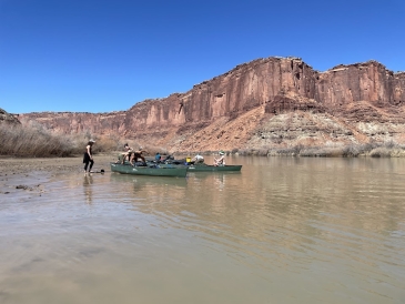 a picture of Kalina's trippees on the green river, getting ready to canoe