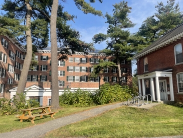 A picture of the grassy courtyard just outside the Topliff undergraduate student housing building at Dartmouth College on bright sunny day