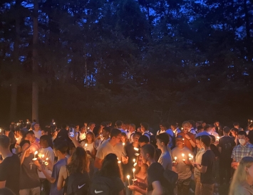 a picture of a crowd of people all holding candles--dartmouth's annual twighlight ceremony to welcome new students