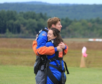 Colleen and a friend hugging to celebrate that they survived!