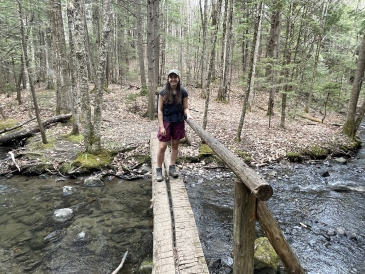 a picture of Kalina standing over a brook