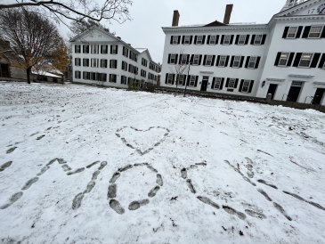 Picture of footprints in the snow that spell out the word mock with a heart above it