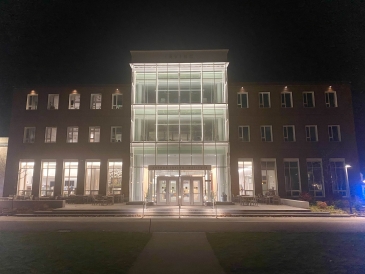a picture of Dartmouth's Irving Institute at night