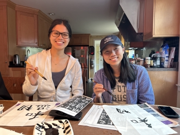 Diana '23 and Kate '24 practicing their calligraphy in the Chinese Language House