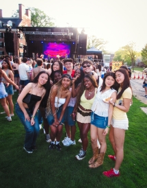My friends and I posing by the stage on Gold Coast Lawn surrounded by a crowd of students.