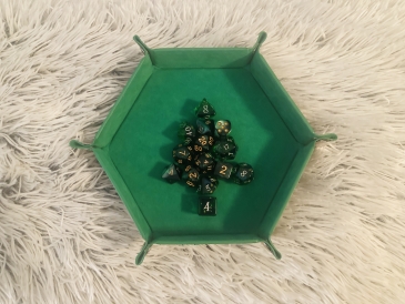 Several sets of DND dice super duper artistically arranged to imitate the Lone Pine Dartmouth logo.