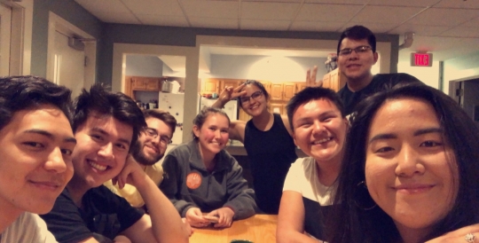 Gabe and friends taking a picture while baking cookies