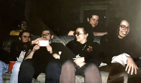 Band hanging out in cabin