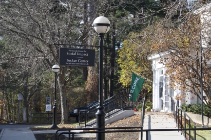 south fairbanks building with the trees and the sign for the tucker center and social impact (DCSI)