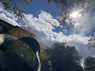 An image of the statue in front of Fairchild Hall with the sky