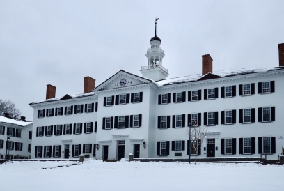 Dartmouth Hall surrounded by snow with the display of a light gray sky