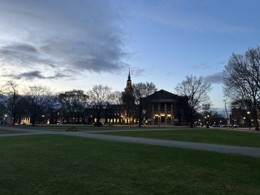 An image of Baker Berry Library against the setting sun.