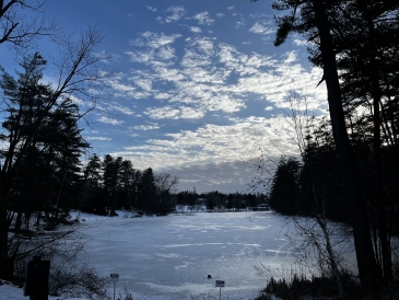 An image of Occom Pond in the sun