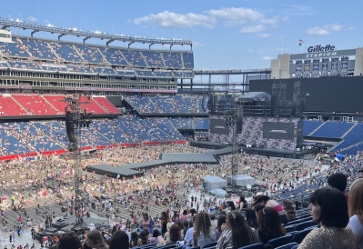 An image of the crowds at a Taylor Swift concert at Gillette Stadium.