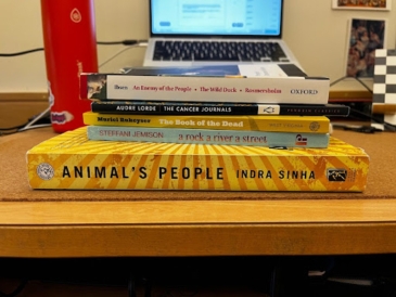 a stack of books on a desk