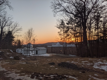 View of a sunset and Dartmouth's Campus behind the Shattuck Observatory