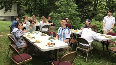 Students eating outside for a summer dinner