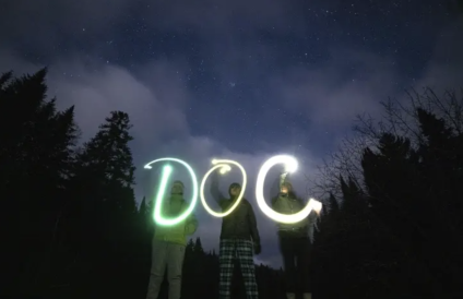 DOC spelled out in the night by glowing lights