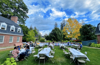 community dinner at the back lawn of triangle house