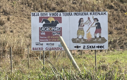 A sign reading "Welcome to Krenak Indigenous Land"