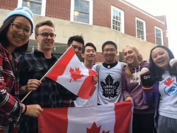 Shuyi and friends posing with the Canadian flag. 