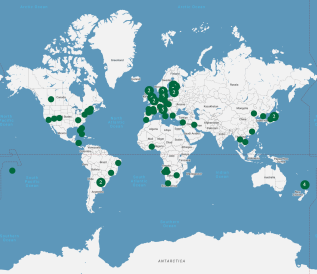 A blue and white map of Dartmouth's study abroad locations, denoted in green. 