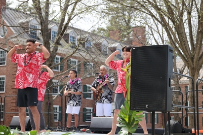 Tevita Moimoi '24 and Gabriel Gilbert '23 dancing hula at 2022 luau.