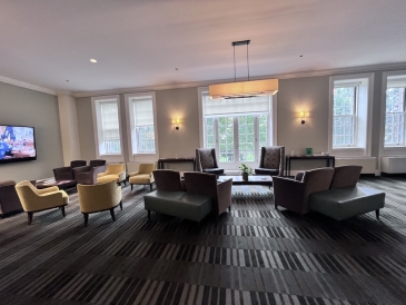 The Chamberlain Room in the Dartmouth Office of Undergraduate Admissions. The room is empty, and consists mostly of armchairs.
