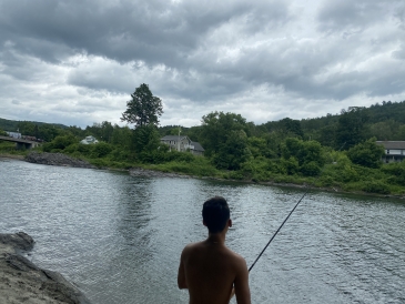 Azariah Javillonar '23 fishing on the River