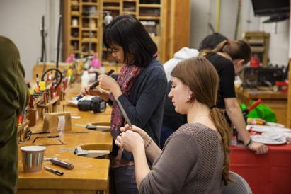 students working in jewelry studio 