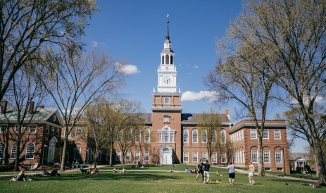 A photo of students enjoying spring on the Baker Library lawn