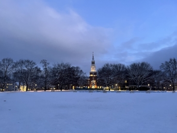 An image of Baker Berry library in the snow, early morning