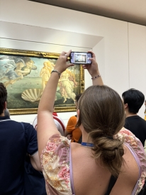 A photo of my friend, Gemma, taking a photo of The Birth of Venus by Sandro Botticelli