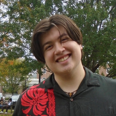 Image of Gabriel G '23; wearing black and red patterned aloha shirt