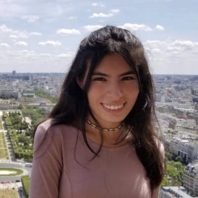 Girl with purple shirt and Paris background 