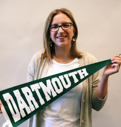 Isabel holding Dartmouth pennant