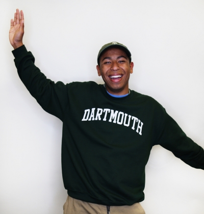 Tulio smiling with Dartmouth sweatshirt