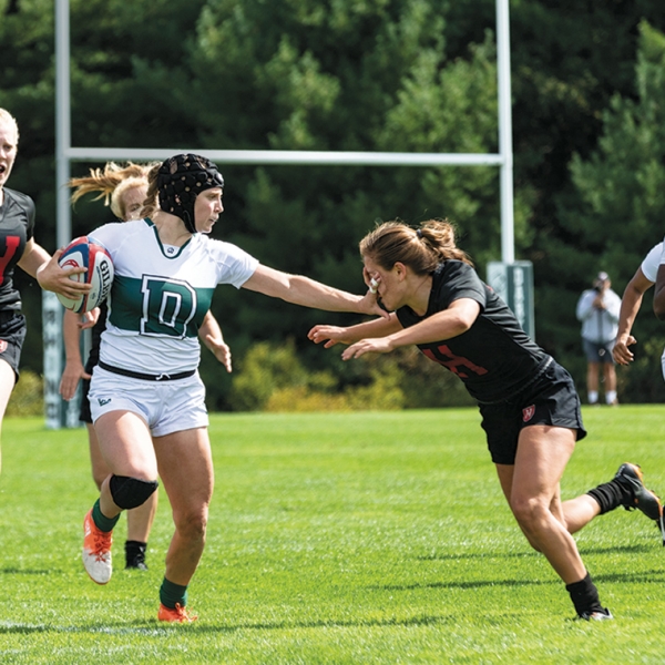 A photo of Dartmouth's Woman's Rugby team playing Harvard