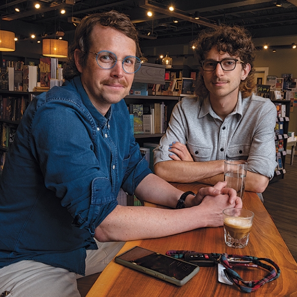 A photo of professor Jonathan Phillips and student Eli Hecht '23 at Still North Books