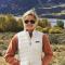 woman in front of majestic mountains