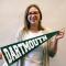 Isabel holding Dartmouth pennant