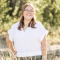 Lauren looking radiant standing in a field