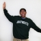 Tulio smiling with Dartmouth sweatshirt